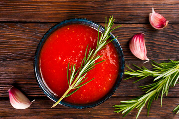 Poster - Tomato sauce with spice in black bowl