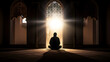 silhouette of a muslim boy praying in a mosque