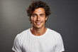 © sofiko14 - Portrait of a young Caucasian brunette man on a gray background