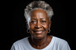 © sofiko14 - African american senior woman in white t-shirt on dark gray background