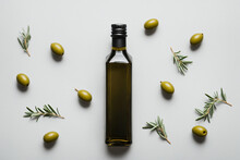 Bottle Of Olive Oil On Grey Background