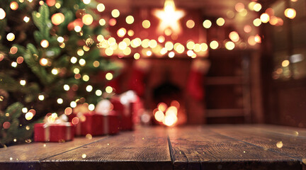 Poster - Christmas background. Wooden background closeup with blurred Christmas tree and gifts against the backdrop of the fireplace and holiday lights