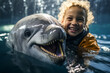 Little girl swimming joyfully with dolphin.