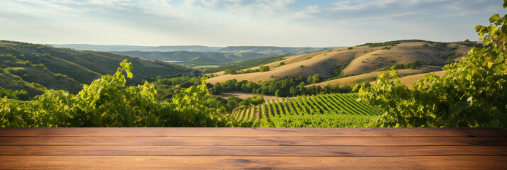 Wooden empty table close-up against blurred vineyards, wine presentation or tasting concept, banner