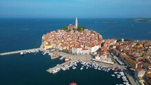 Stunning aerial cityscape of Rovinj town, Croatian fishing port on the west coast of the Istrian peninsula. Bright morning seascape of Adriatic Sea, Croatia