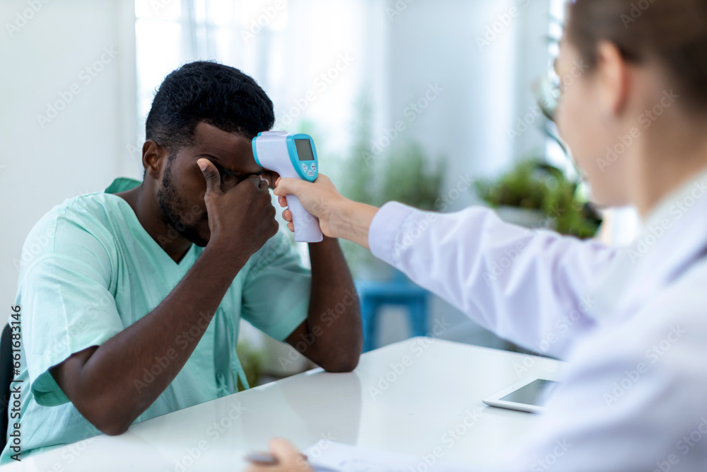 Doctor checking patient's temperature screening to patient inside the ...