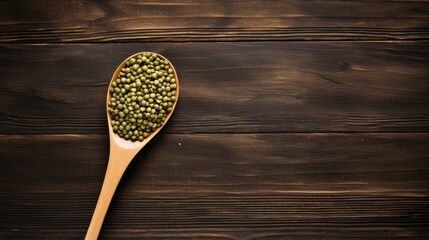 Wall Mural - Spoon cradling mung beans on an old-world wooden surface