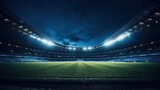 Fototapeta Sport - Vast soccer stadium, illuminated and awaiting action under the night sky