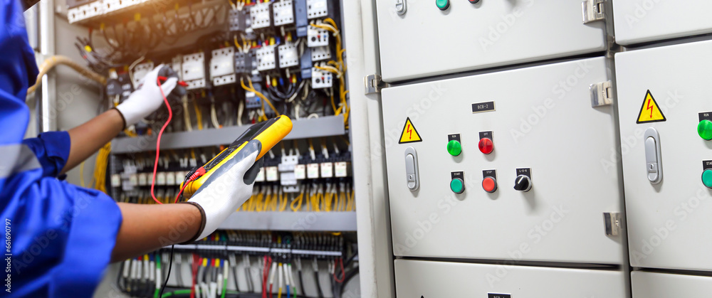 Electricity and electrical maintenance service. Engineer hand checking ...