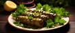 Tasty stuffed grape leaves with parsley on a plate With copyspace for text