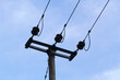 silhouette of electric pole with blue sky background