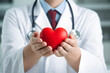 © ordinary042 - Cardiologist doctor holding a red heart