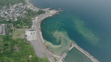 Aerial Footage Of Yin Yang Sea And Mountainside Village On A Cloudy Day In New Taipei City, Taiwan