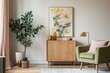 Interior of a chic and vintage dwelling with a framed poster, an old cabinet adorned with gold details, floral vases, foliage, and books. Beautiful design. Minimalist concept. Generative AI