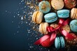 Colorful macaroons on blue background. Top view with copy space