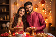 © Neha - Young indian couple celebrating diwali festival at home