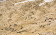 Texture And Relief Of Limestone And Chalk Layered Mountain Slopes In Mangistau, Hills With Ditches From Water Streams