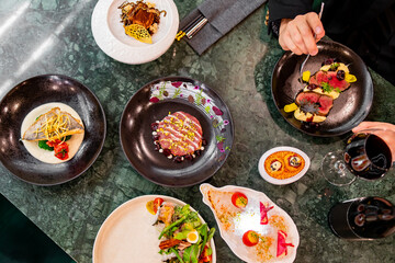 Poster - variety of restaurant food dishes on table