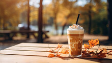 Pumpkin Latte On The Bench In Autumn Park. 