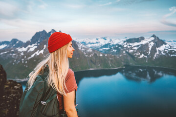 Wall Mural - woman hiker exploring norway with backpack active healthy lifestyle mountains adventures travel vaca
