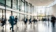 © ibreakstock - Bright office lobby with fast moving crowd of business people in long exposure shot