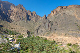 Fototapeta Miasto - Agricultural village and white mosque in the mountains of Wadi Ghul. Oman.