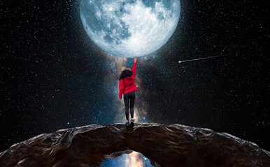 Wall Mural - woman tries to touch the moon with her hand