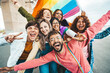 © Davide Angelini - Diverse group of cheerful young people celebrating gay pride day - Lgbt community concept with guys and girls hugging together outdoors