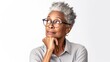 Portrait of pensive confident senior African American woman imagines something in her mind, looks upwards, being deep in thoughts, touching chin, isolated on white, copy space.