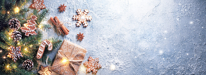 Wall Mural - christmas tree branches, gingerbread cookies, gift boxes and ornaments