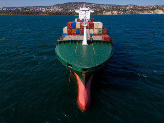 A container ship in the sea, aerial view