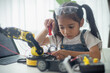 © FAMILY STOCK - STEM education concept. Asian young girl learning robot design.