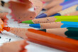 sharp pencil of different colors on paper close-up