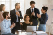© fizkes - Happy excited diverse young business team celebrating work success, good news, laughing, enjoying teamwork sales result, successful cooperation, applauding to colleague with winner hands at laptop