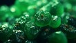 Macro of realistic raisins on emerald green.