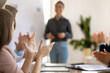© fizkes - Inspired motivated business audience applauding coach after successful presentation, thanking leader for meeting, collaboration, motivation, giving positive feedback