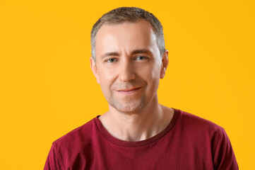 Sticker - Portrait of handsome mature man on orange background