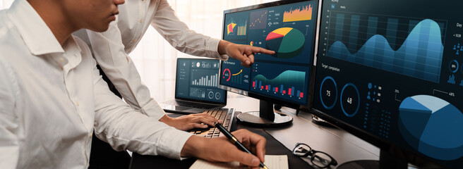 Poster - Analyst working on data analysis or BI dashboard on computer monitor. Business team analyzing financial data by Fintech in corporate office for business marketing and strategy planning. Trailblazing