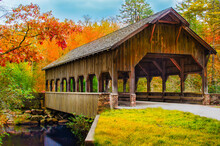 High Falls Covered Bridge Surrounded By Fall Foliage In North Carolina