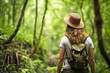 Rear view of environmental conservation woman worker investigate with backpack in background of forest. Ecosystem concept of environment and nature.