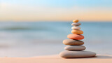 Fototapeta  - A minimalist view of a perfectly stacked arrangement of colorful pebbles on a serene beach, Pebble Stack in Minimalist zen balance, Stack of stones on the beach promoting mediation yoga mindfulness