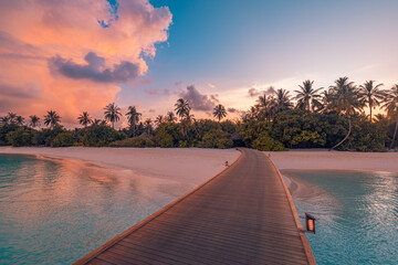 Wall Mural - Amazing sunset panorama Maldives. Luxury resort pier path seascape romantic led lights colorful sky clouds. Paradise island coconut tree silhouette. Best travel beach background. Panoramic vacation