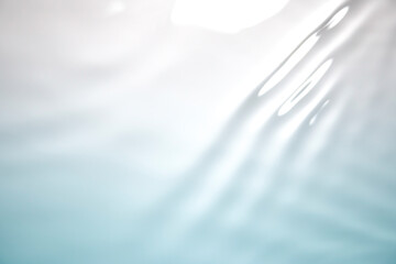 Wall Mural - the clear blue surface of the water gradients from light to dark.