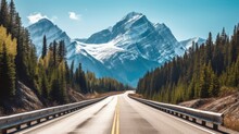 A Mountain Road With Towering, Snow-capped Peaks