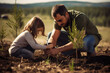 © Helena GARCIA - padre joven con su hija plantado arboles en el campo. Concepto de ecología, dia de la tierra,  planeta, dia del padre