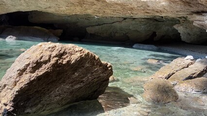 Canvas Print - Sea cave grotto on rocky coast.