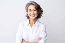 Portrait Of Asian Senior Woman Posing On White Wall Background.