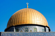 Close Up Of The Dome Of The Rock On The Temple Mount In The Old City Of Jerusalem Israel. Golden Dome Of A Temple With Walls Decorated With Mosaic. The Upper Part Of Temple With Space For Your Text.