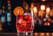 © Shubham - a glass of cold red cocktail on a bar counter in the bar. the concept of a alcoholic beverage in the bar.a glass of cold red cocktail on a bar counter in the bar. the concept of a alcoholic beverage i