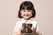 プレゼントを手に持つ日本人の子供（クリスマス・バレンタイン・記念日）